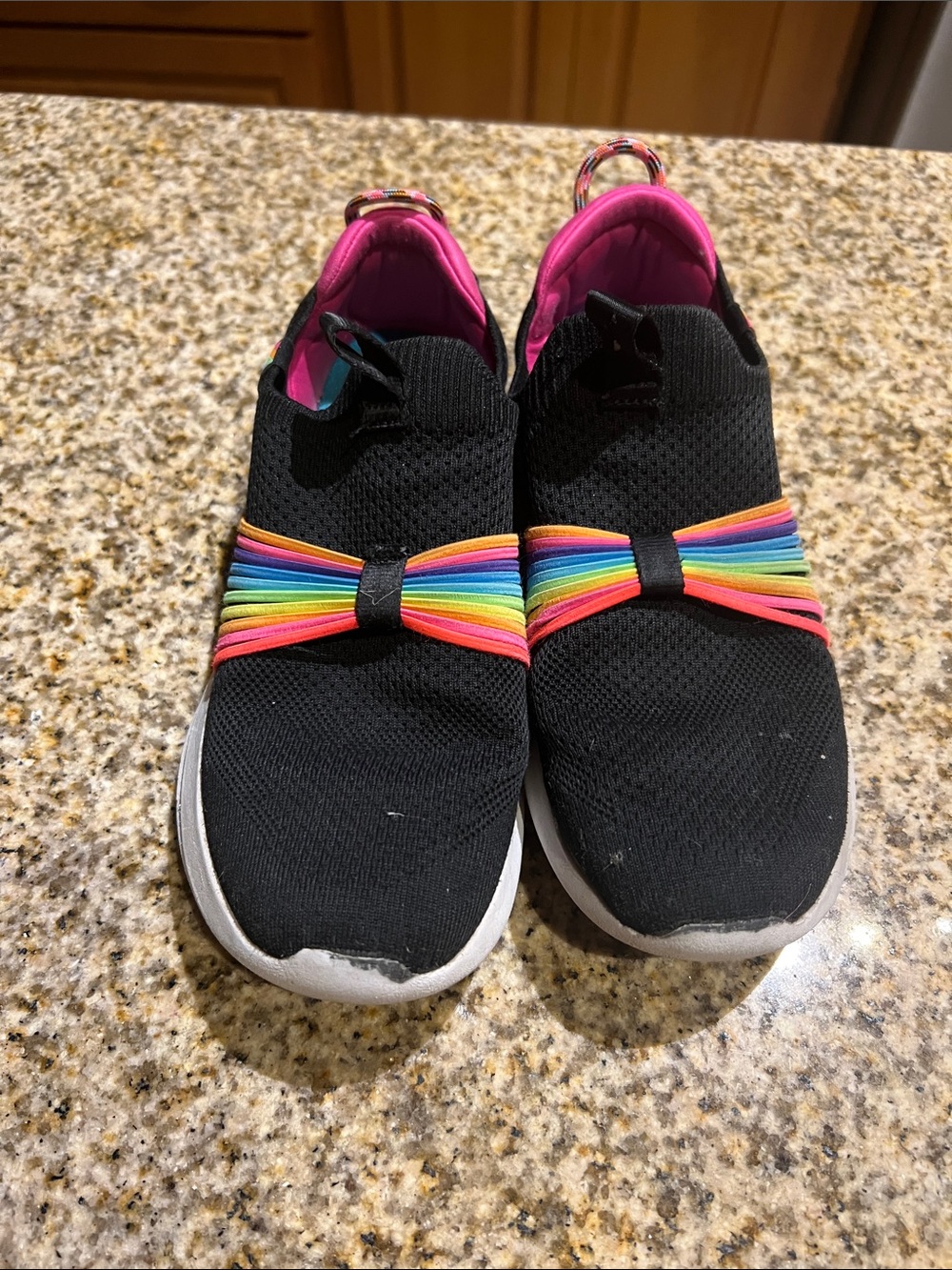 Skechers Black Kids Slip-On Sneakers with Rainbow Bow